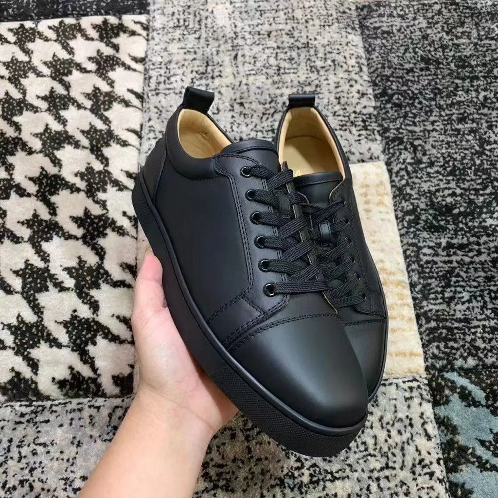 Men's grey low-top casual sneakers with colour-block design, stitched rubber sole, and front lacing