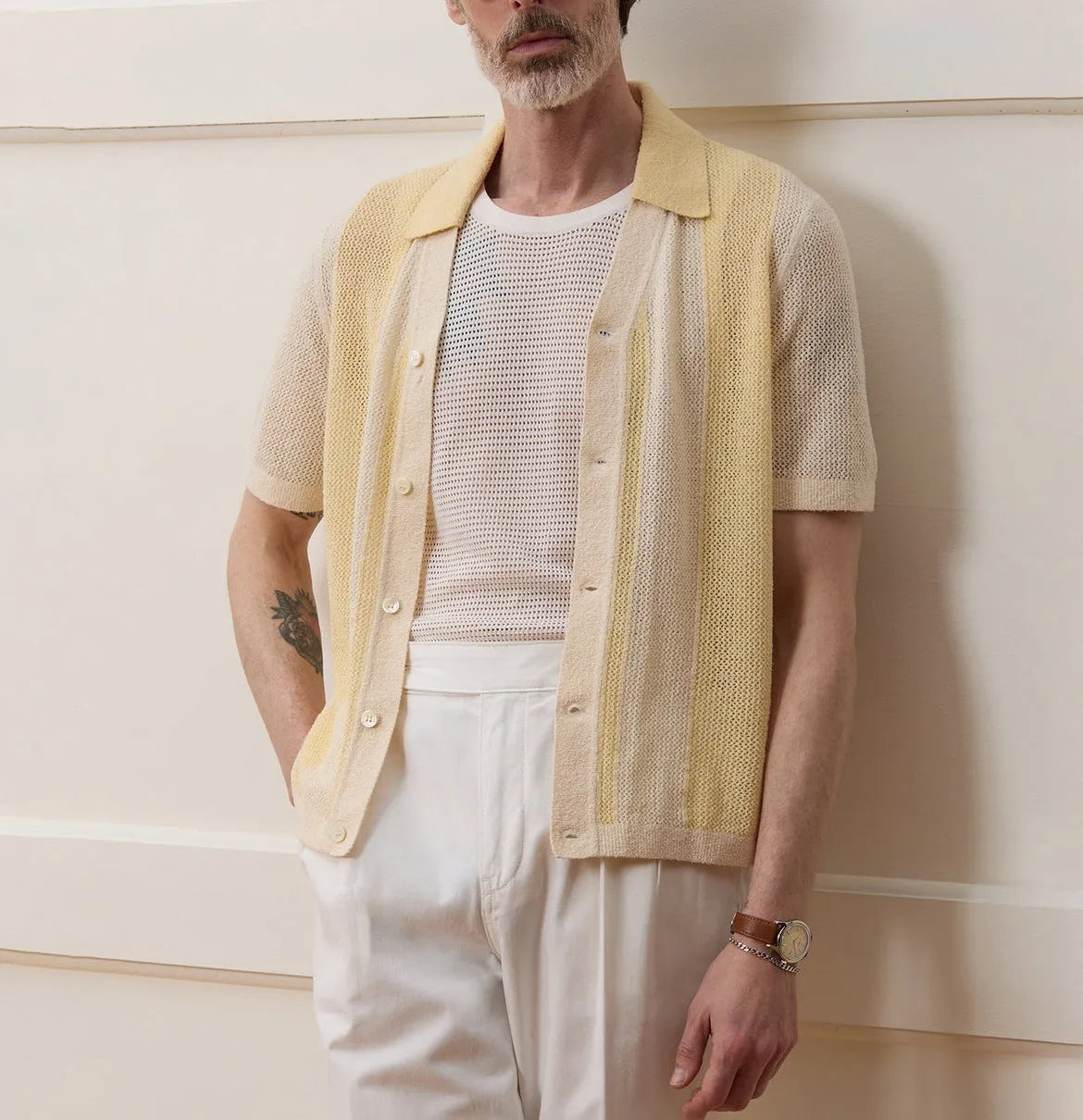 Yellow casual polo shirt with hollow-out design and asymmetric cut, short sleeves, made from Tencel fabric.