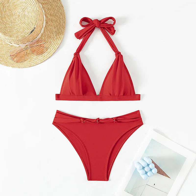 Red women's halterneck bikini with adjustable tie and high-cut shorts for swimming
