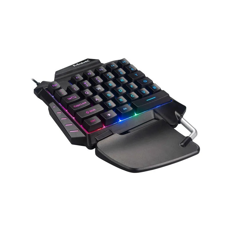 Black left-hand Throne gaming keyboard with wrist rest and USB connector for desktop PUBG gaming