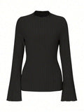 A black long sleeve round neck top with lantern sleeves and a slim fit, showcasing a brushed polyester fabric.