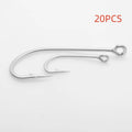 Assortment of alloy sea fishing hooks on a blue background for ocean boat fishing.