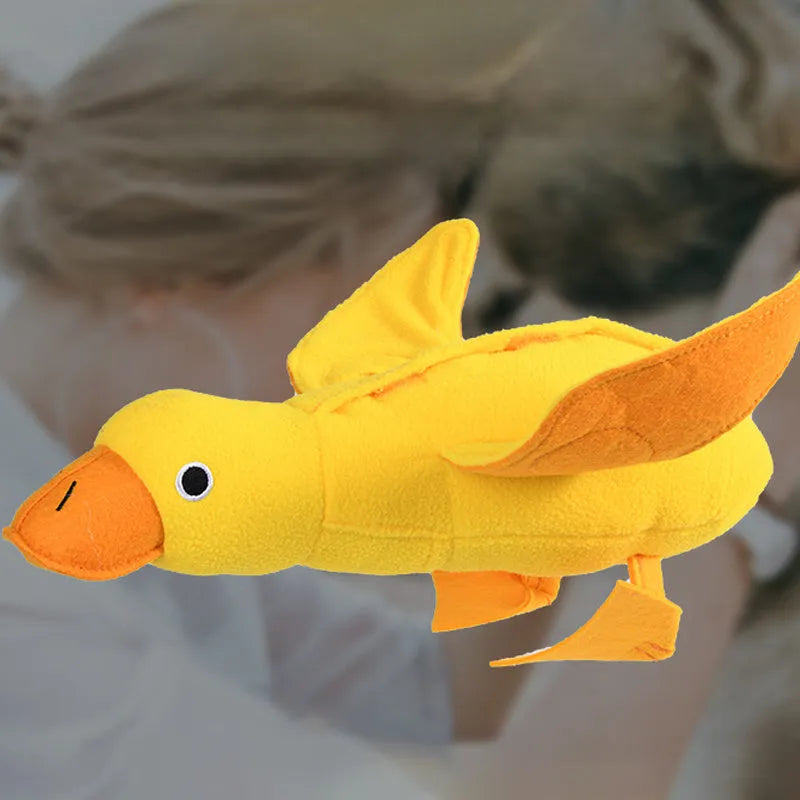 Yellow rubber duck dog toy with squeaker and treat compartment for puppy training and teething.