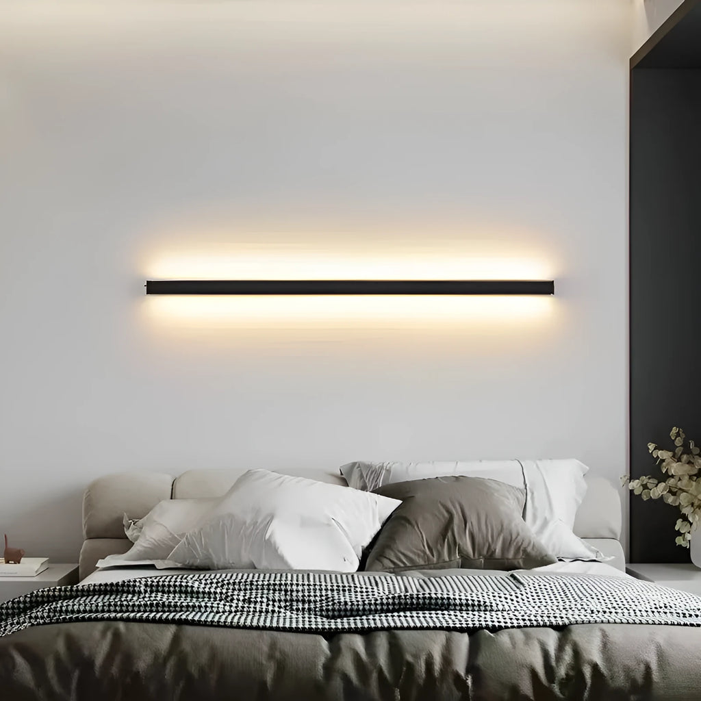 Black 80cm long aluminium LED strip wall lamp mounted on a wall with touch control for colour changing.