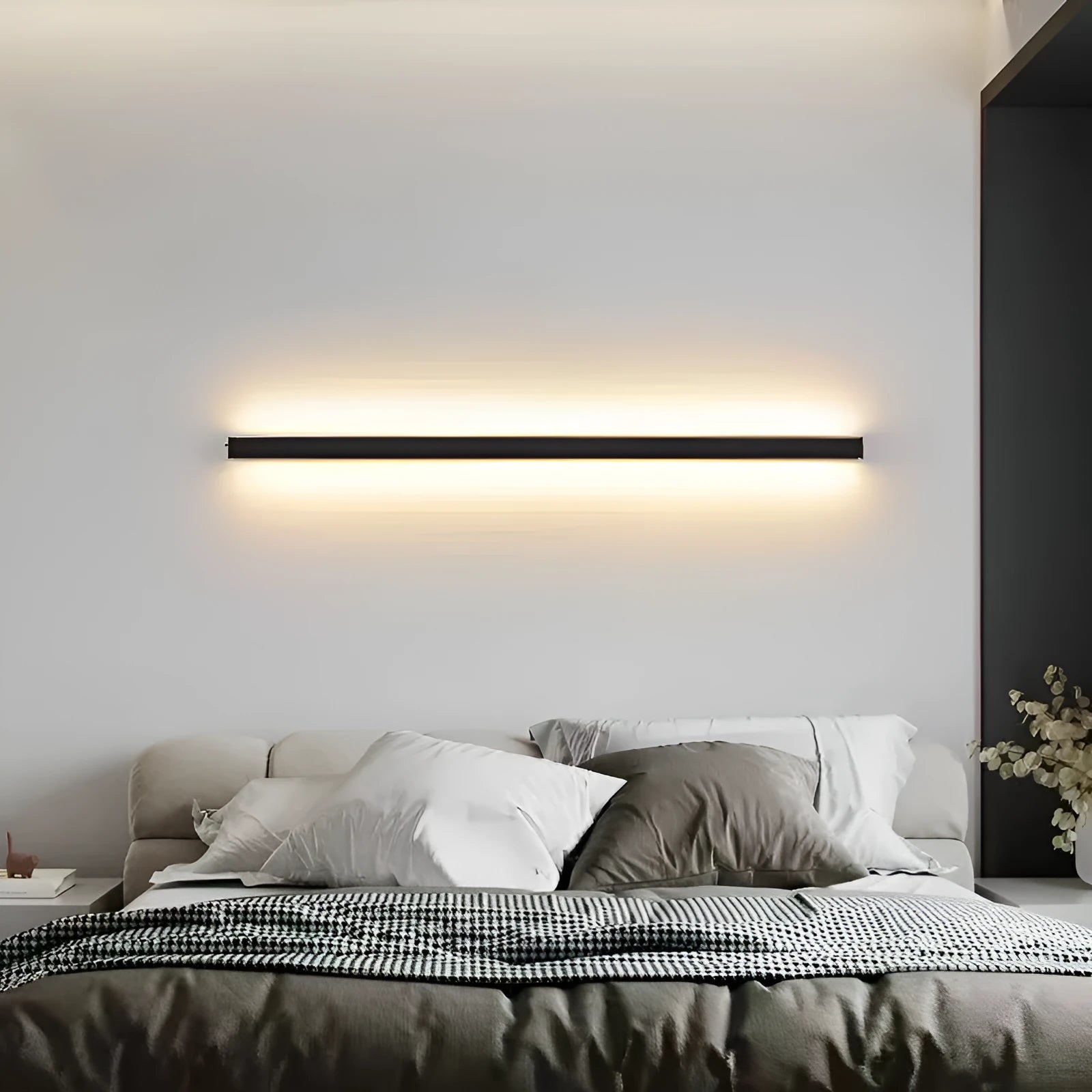 Black 80cm long aluminium LED strip wall lamp mounted on a wall with touch control for colour changing.