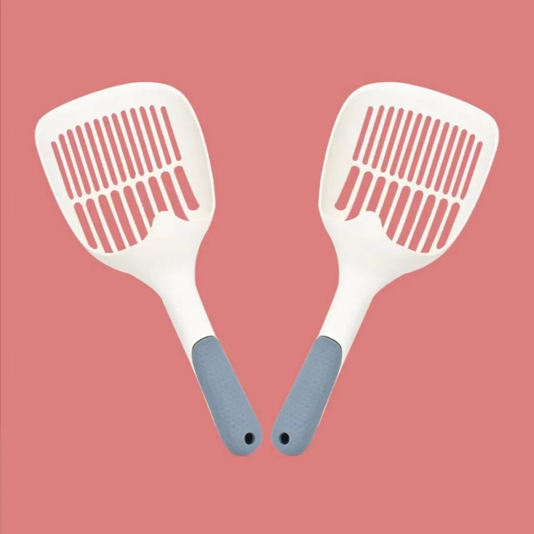 Large white plastic cat litter shovel for scooping clumping tofu cat litter.