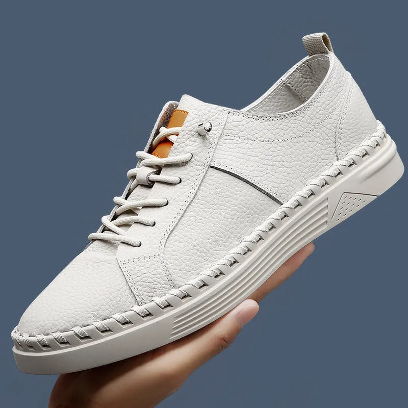 Men's beige and black round toe casual sneakers made from first layer cowhide with visible stitching.