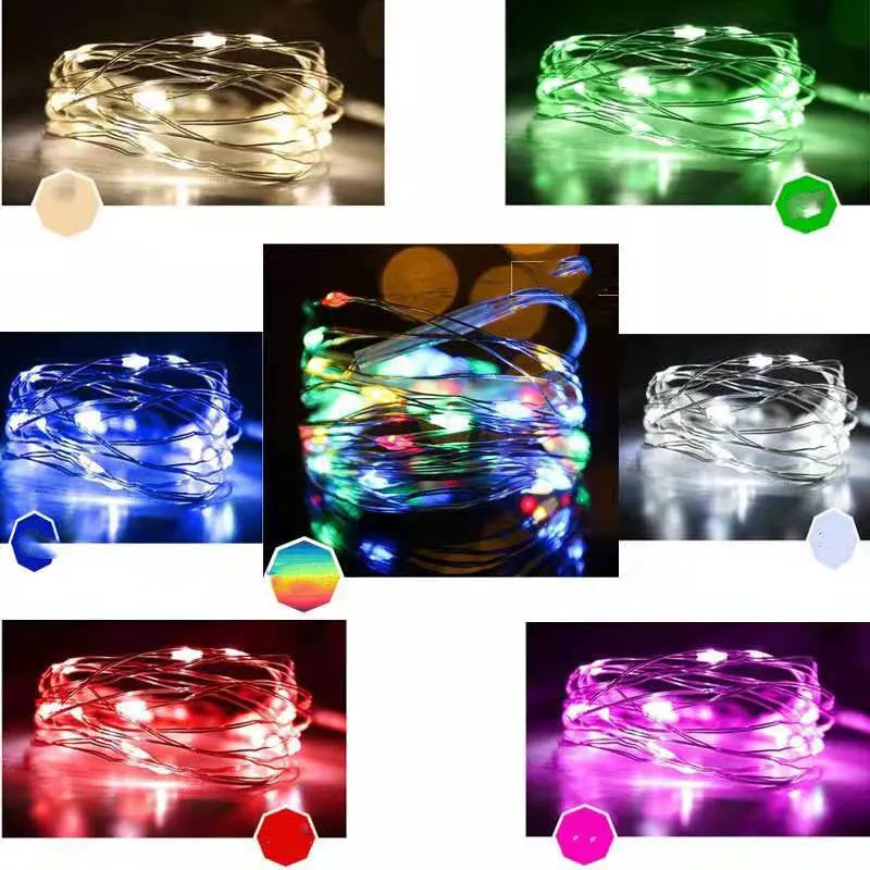 Flexible copper wire string light with 120 LEDs wrapped around a branch, showing battery box and USB connection.