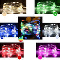 Flexible copper wire string light with 120 LEDs wrapped around a branch, showing battery box and USB connection.