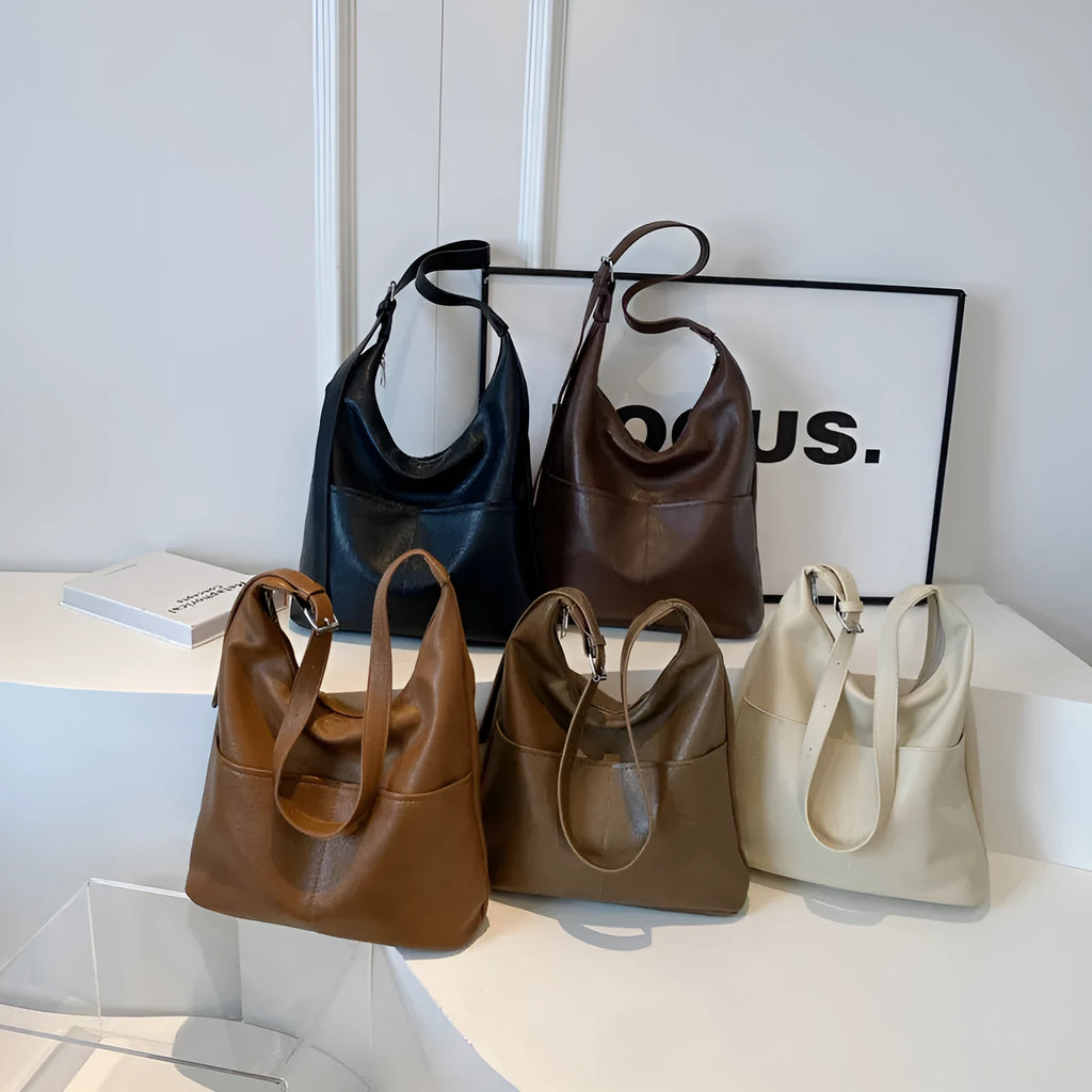 Women's large-capacity shoulder bag in soft PVC with bucket shape and stitching detail, available in black, coffee, brown, mud, beige