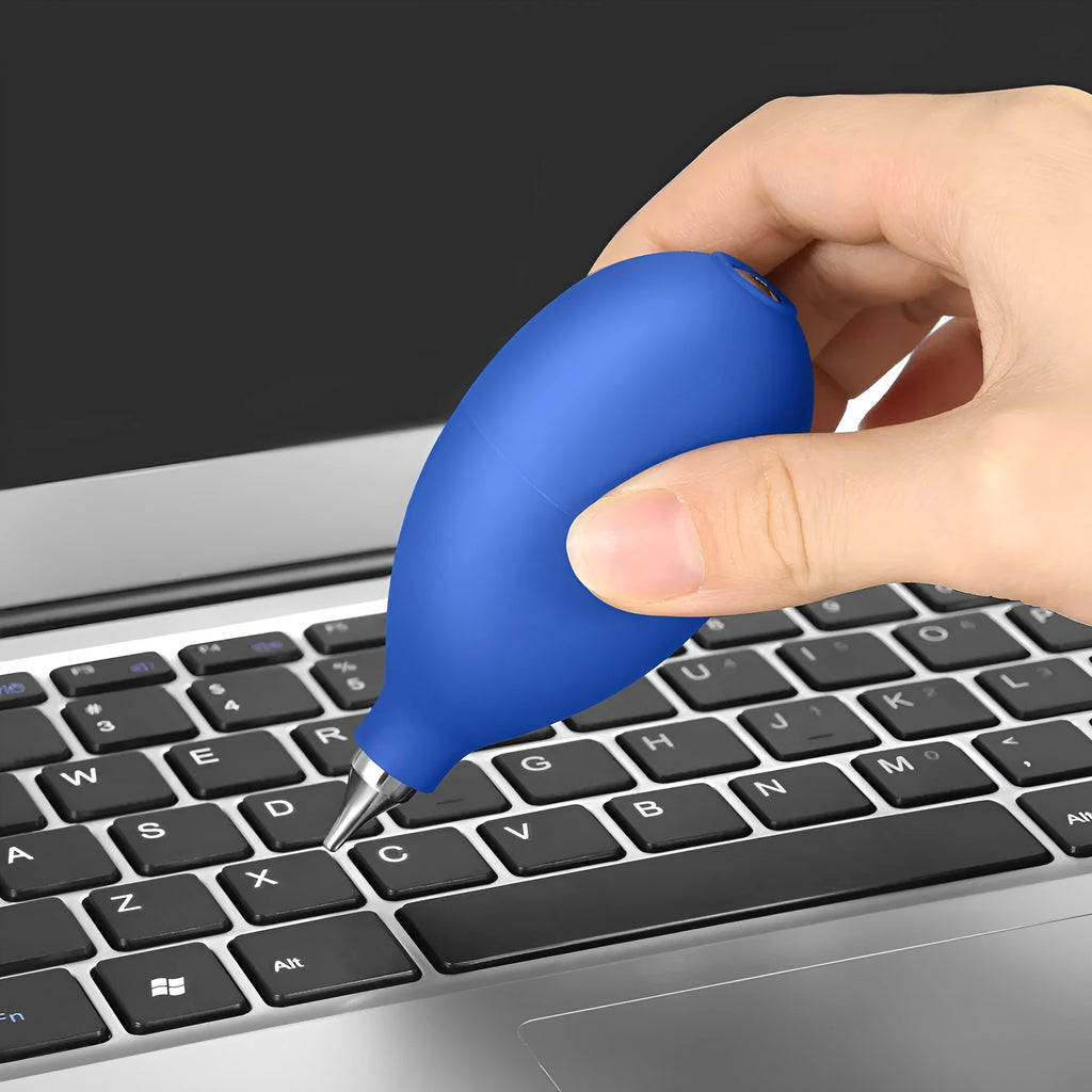 Blue and black handheld rubber dust blower cleaning tool for cameras and electronics.