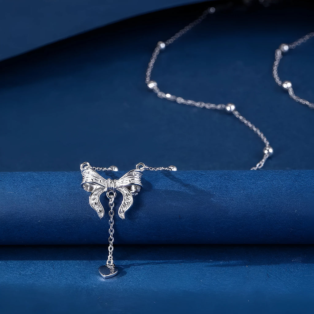 S925 silver adjustable clavicle chain with heart pendant featuring butterfly and bow design