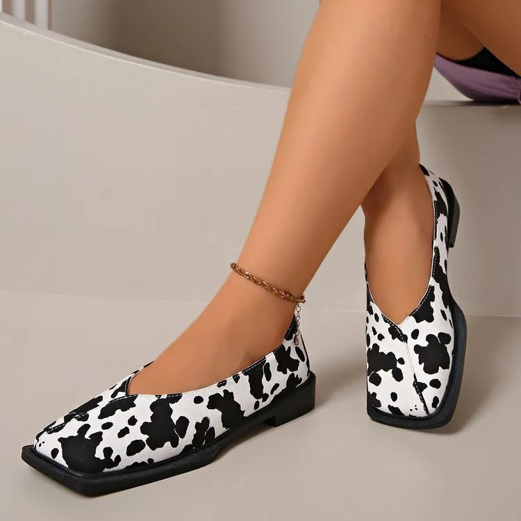 Women's black and white cow pattern flat shoes in first layer cowhide with 6-8cm high heel and rubber sole