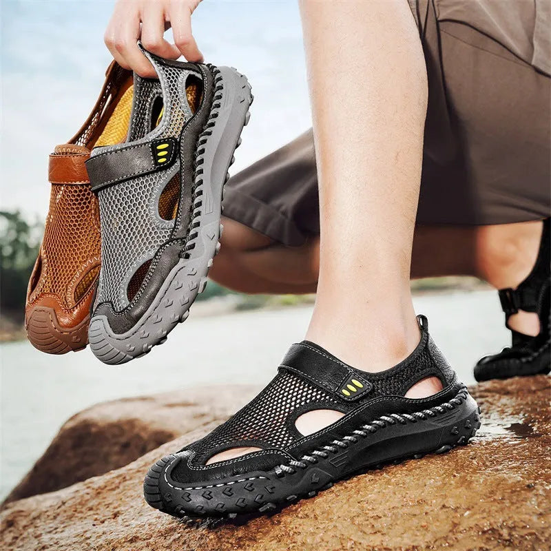 Men's casual sandals with black mesh upper, rubber sole, and adjustable Velcro strap.
