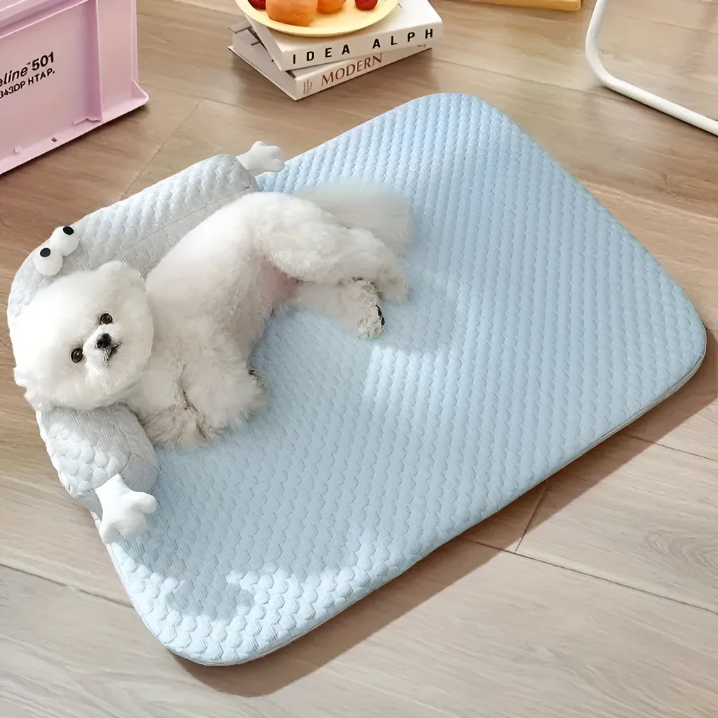Blue pet bed cushion with big-eyed monster design, non-slip base, for dogs and cats.