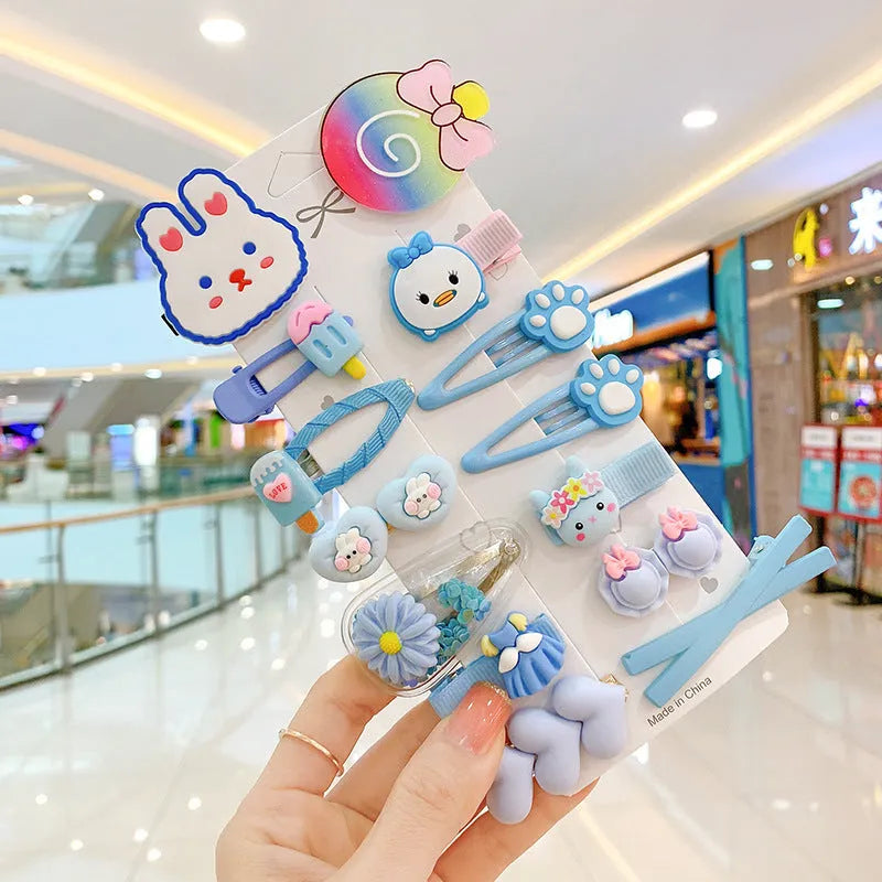 14-piece toddler hair clips set with rainbow barrettes, candy fruit, butterfly, and ice cream patterns on white background