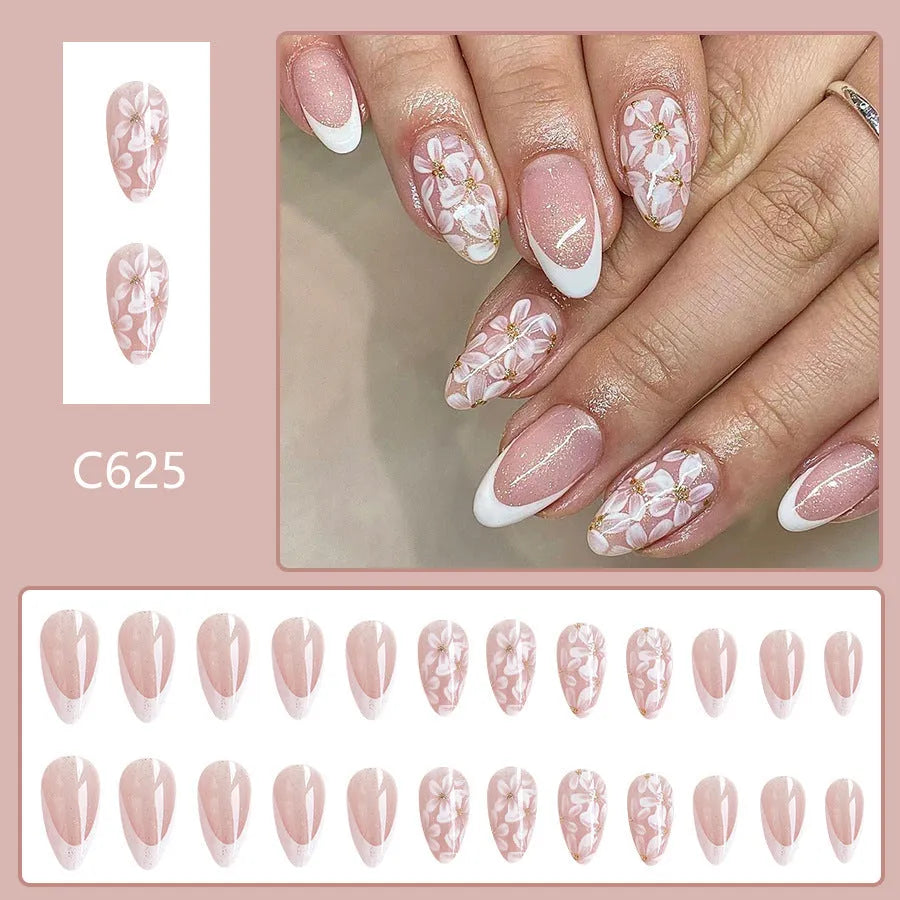 Short almond French manicure artificial nails with glitter and flower patterns in colour C625.