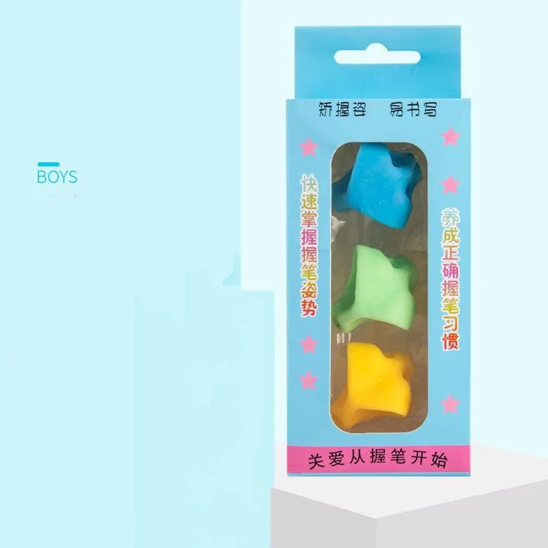 Children's writing orthosis set with five coloured pencil grips and a corrector tool on a table.