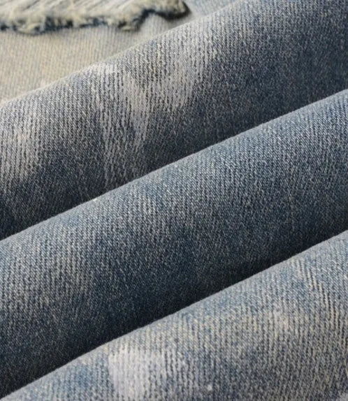 Men's patch slimming perforated denim leggings in light blue, 98% cotton, front view