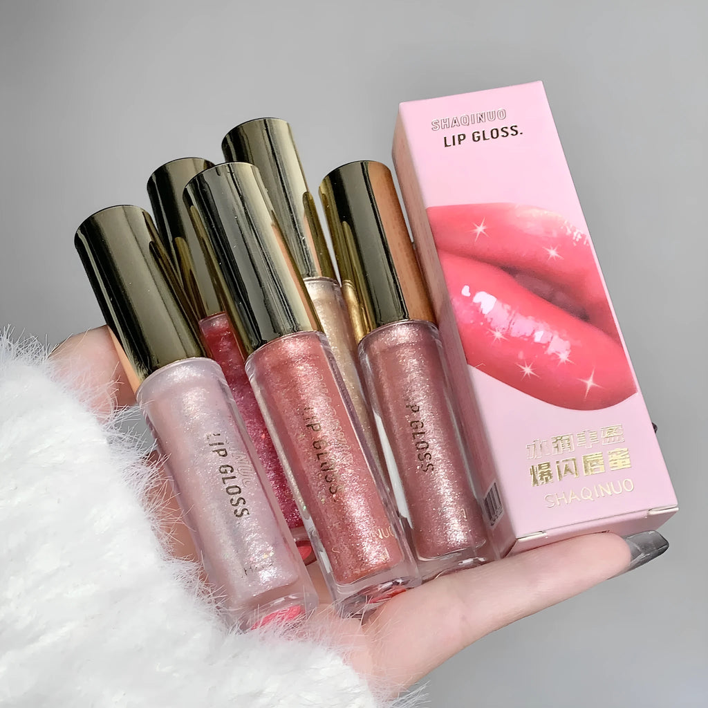 Moisturising lip gloss tube showing reflective finish in choice of five colours: pink, gold, peach, purple, and red.