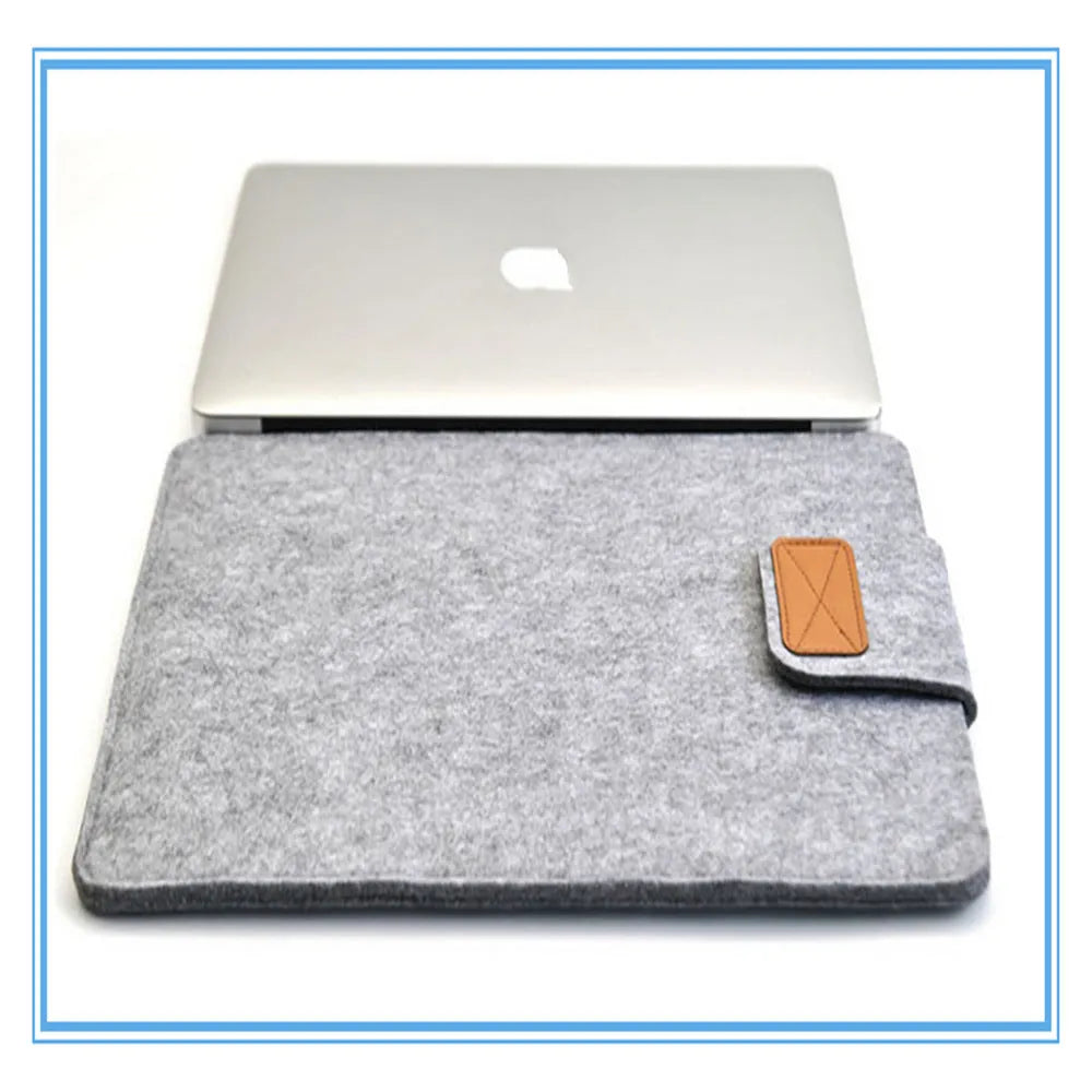 Dark grey clamshell laptop bag open to show plush felt interior for a 14-inch notebook.