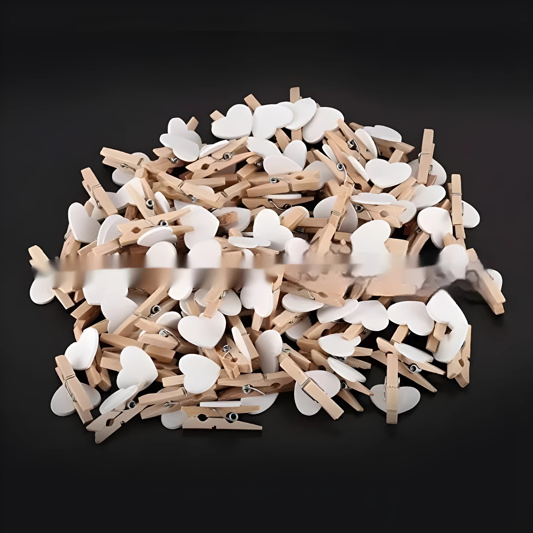 Set of five handmade wooden heart-shaped decorative clips in assorted colours.