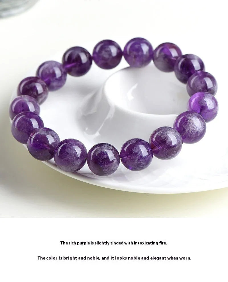Natural feather amethyst crystal bracelet with geometric beads and Ruyi symbol in Snow Mountain purple.