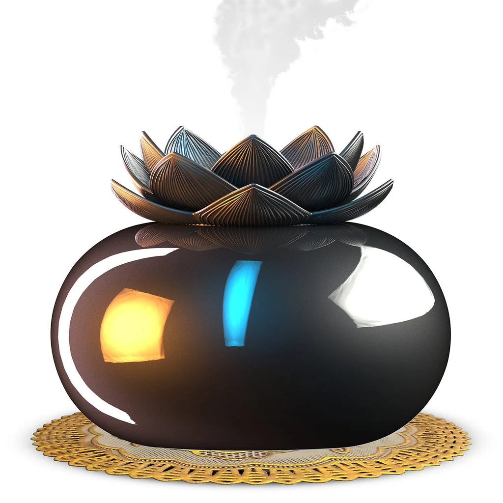 Pure black lotus-shaped aromatherapy humidifier with USB cable on a desk