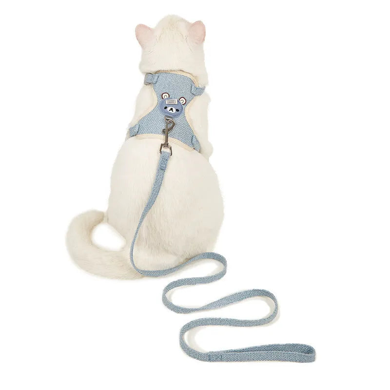 Adjustable dog hand holding rope vest with cloth chest strap and traction rope in beige on a flat surface