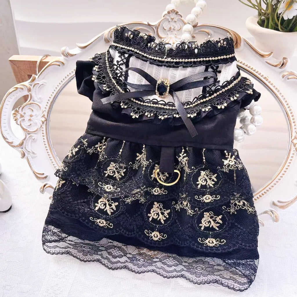 Golden gothic-style layered skirt for a small dog or cat on a mannequin, showing adjustable velvet collar.