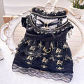 Golden gothic-style layered skirt for a small dog or cat on a mannequin, showing adjustable velvet collar.