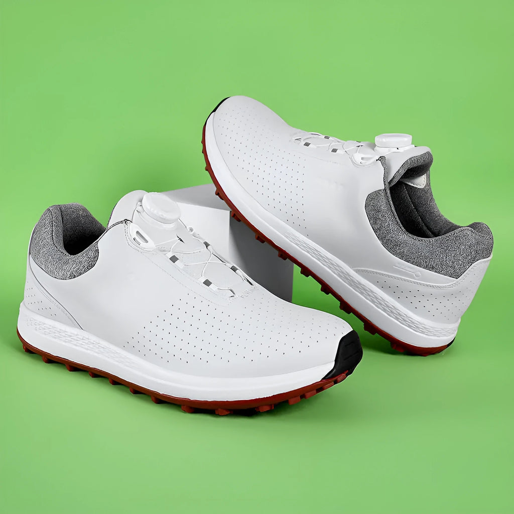Men's white and black low top golf shoes with breathable design and MD sole