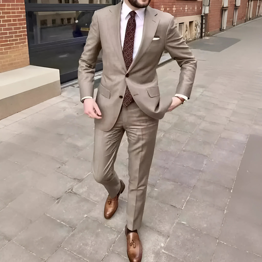 Men's slim fit two-button business suit jacket and trousers on a hanger