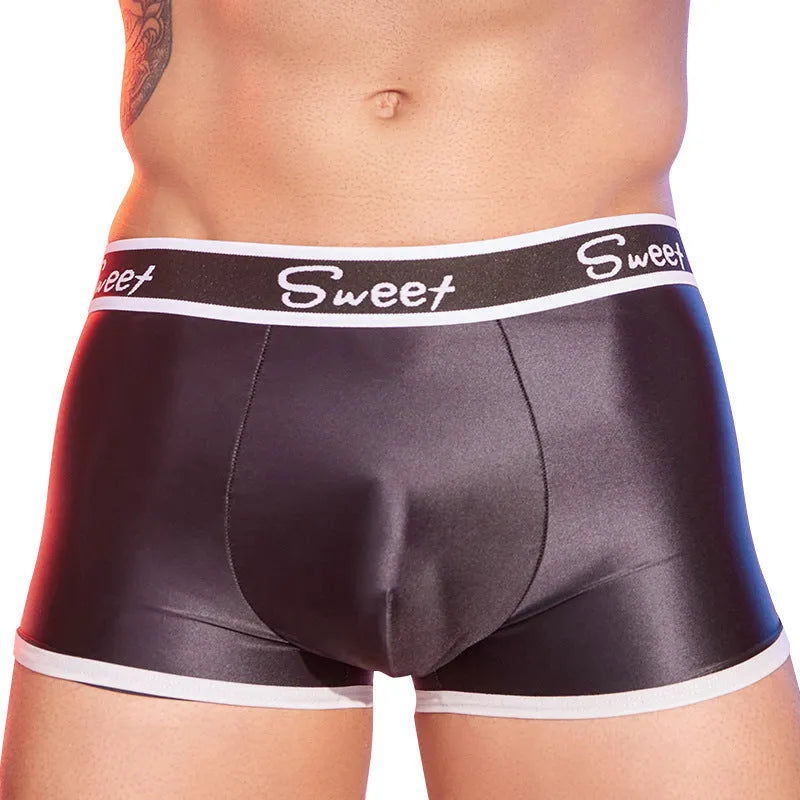 Men's silky shiny boxer shorts in black, white and sapphire blue colours on hanger