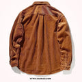 Man wearing a loose caramel corduroy long sleeve cardigan-style shirt