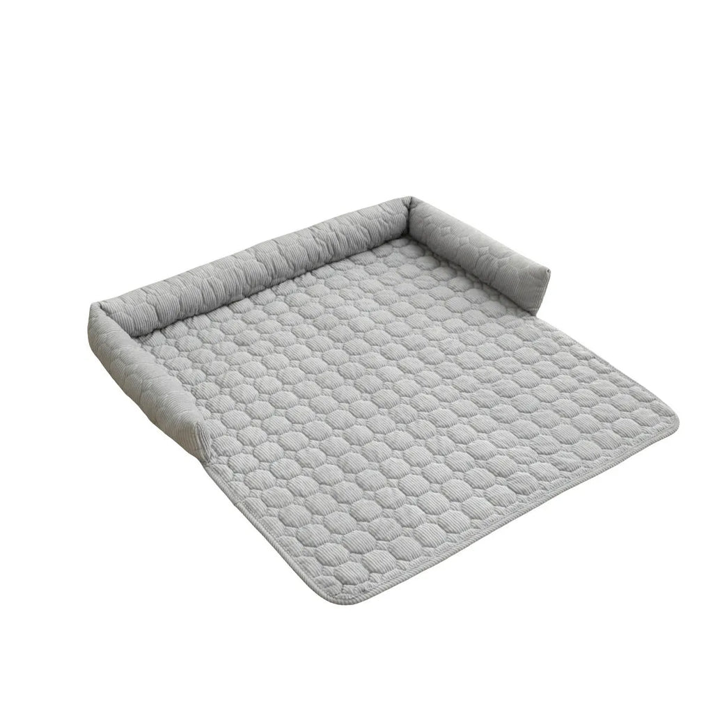 Corduroy pet dog cat bed blanket mat with neck pillow thick soft pad in beige color on a sofa