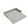 Corduroy pet dog cat bed blanket mat with neck pillow thick soft pad in beige color on a sofa