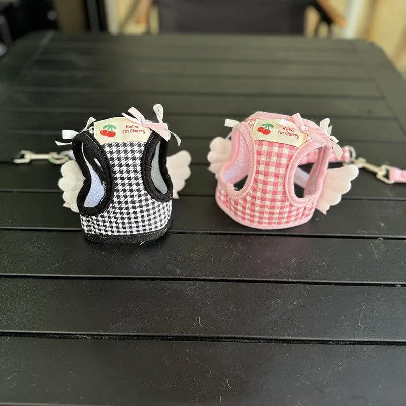 Pink cotton chest and back dog harness with lead for a small dog, size label shown.