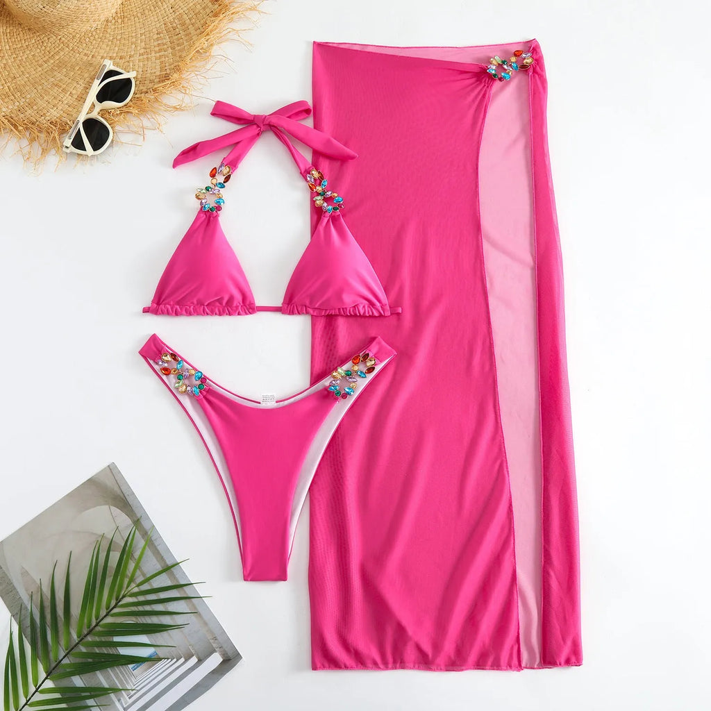 Women's three-piece swimsuit set with bikini top, pants, and matching skirt in solid colour