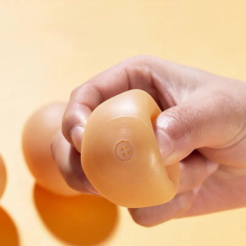Egg-shaped dog toy with sound effects for chewing and dental care