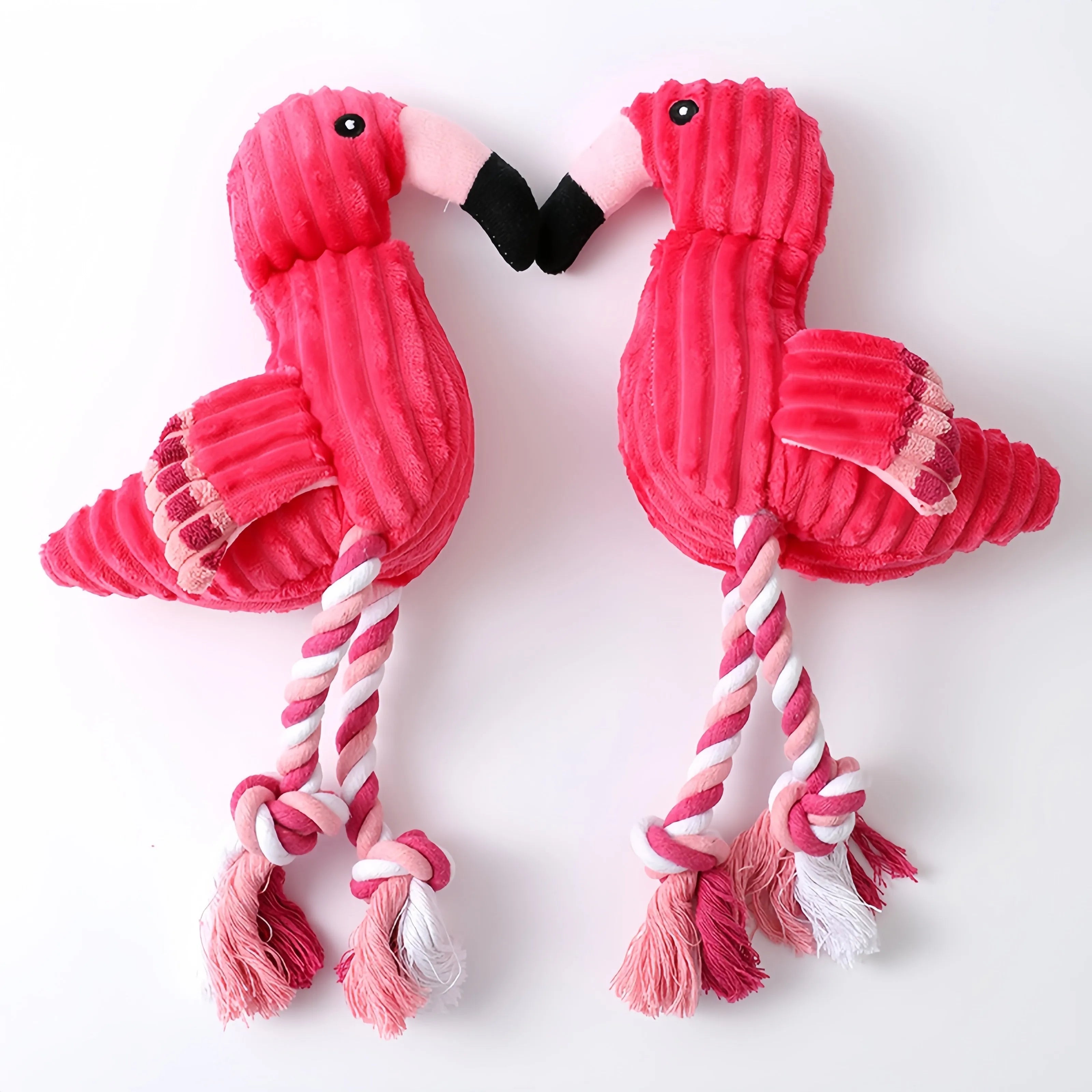 Pink animal-shaped corduroy plush dog toy with a squeaker inside.