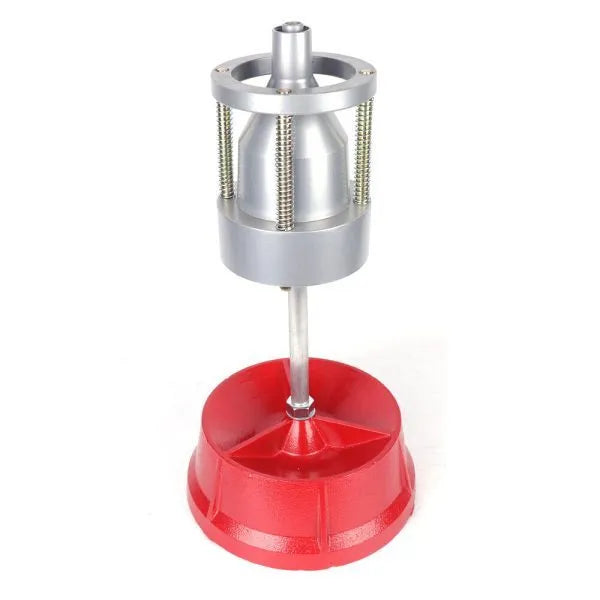 Portable aluminium hub balancer for car wheels with a bull's eye level and enamel-finished base.