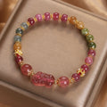 Pink and red candy colour crystal bracelet with tourmaline and strawberry quartz stones, 17 cm length.