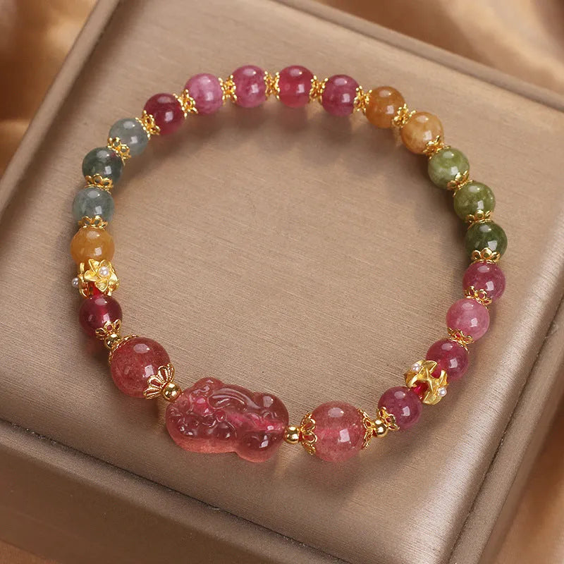 Pink and red candy colour crystal bracelet with tourmaline and strawberry quartz stones, 17 cm length.