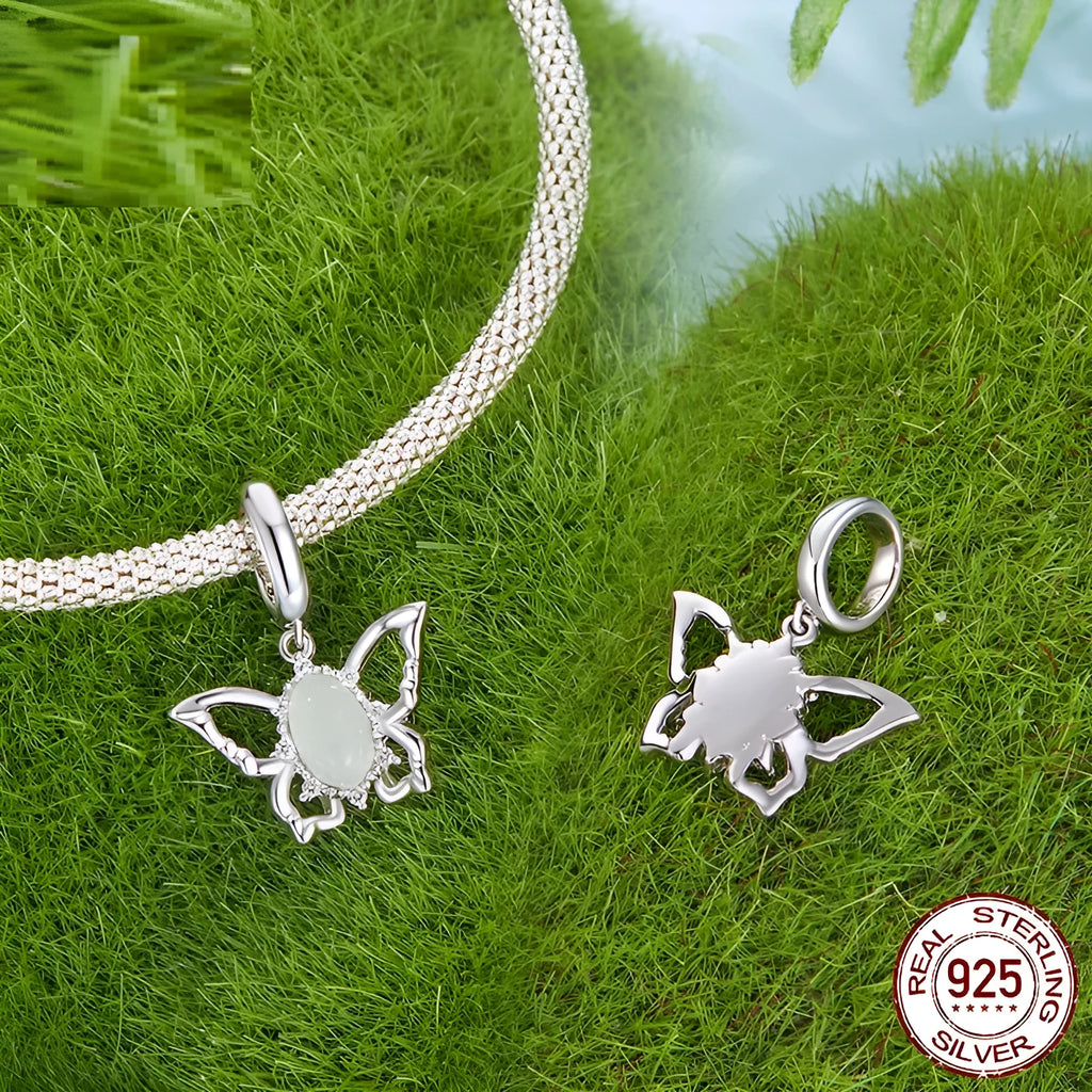 925 sterling silver butterfly pendant with green natural jade inlay on a white background