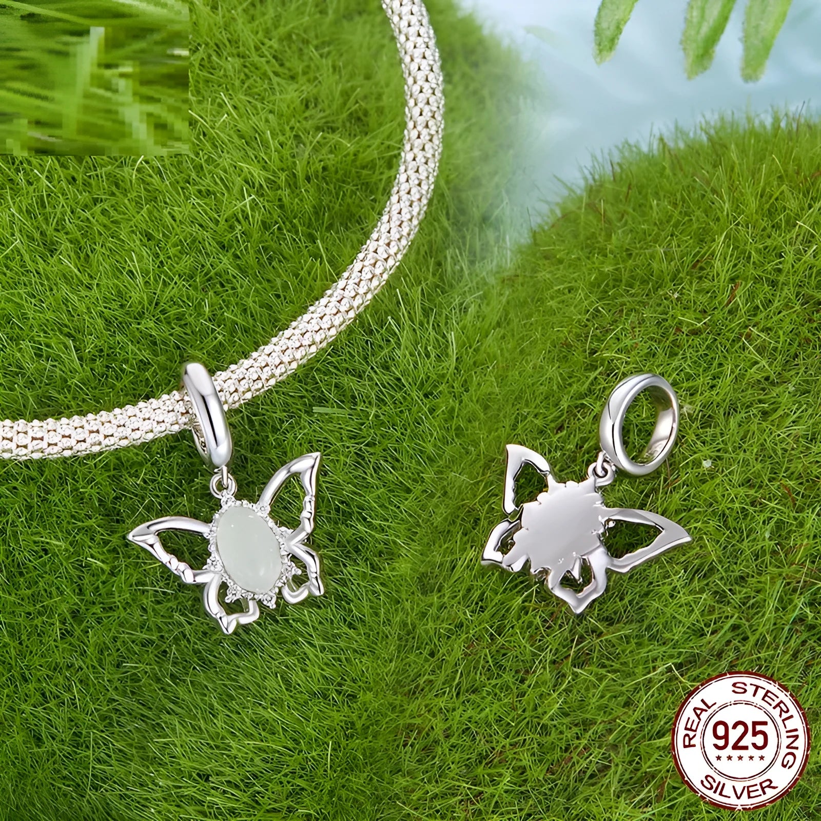 925 sterling silver butterfly pendant with green natural jade inlay on a white background