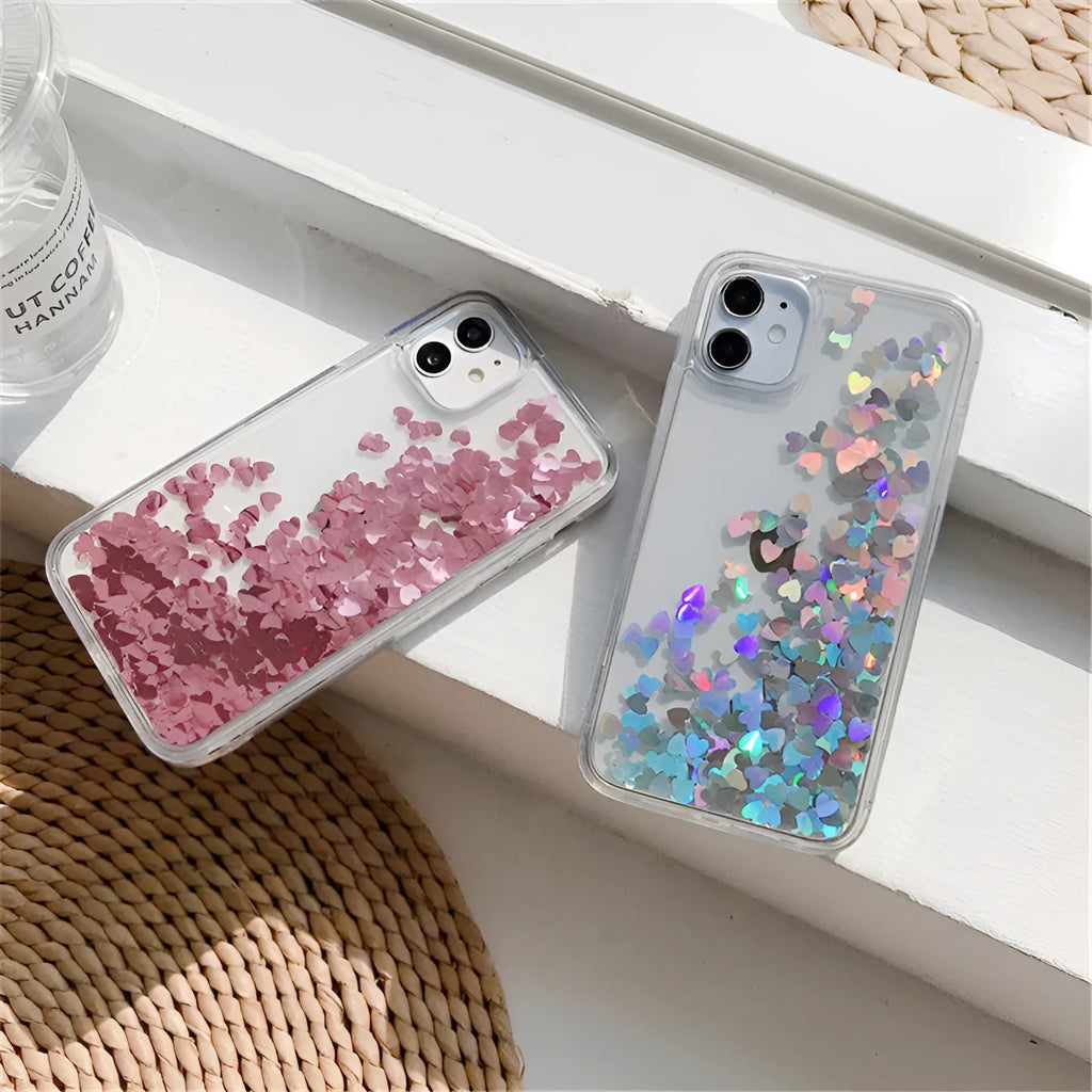 Quicksand flowing love heart silicone phone case in transparent soft TPU bumper for iPhone, available in pink red silver.