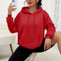 Loose fit women's drawstring hoodie in a choice of multiple colours on a hanger.