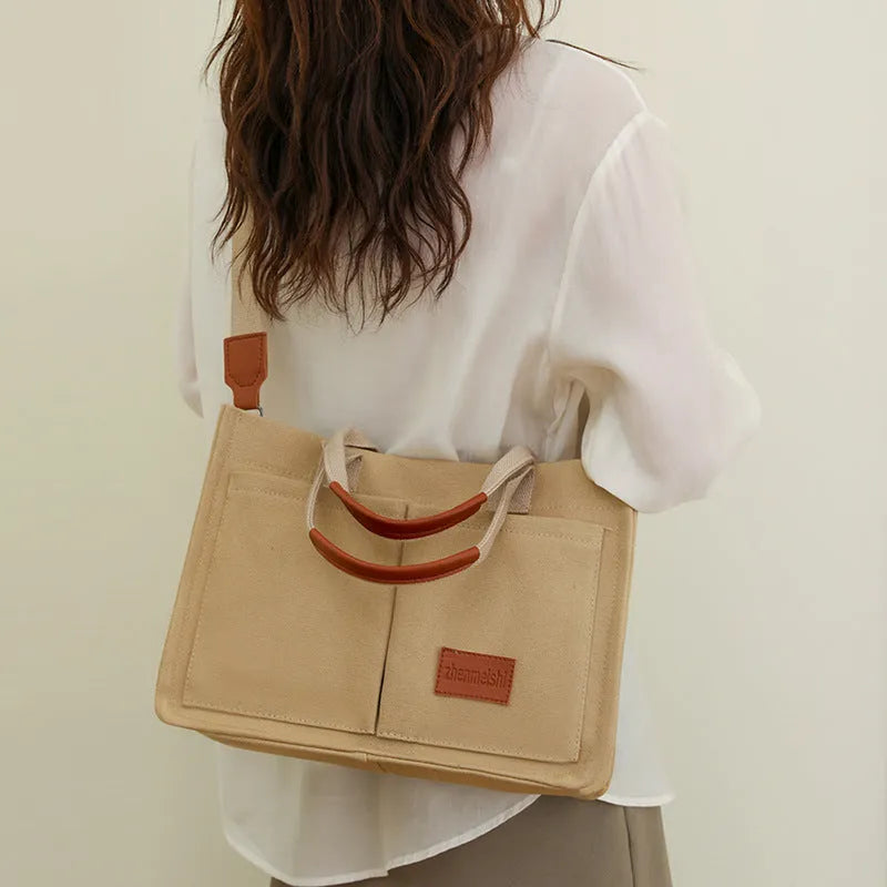 Large capacity canvas tote bag for women with multiple pockets and crossbody strap in creamy white