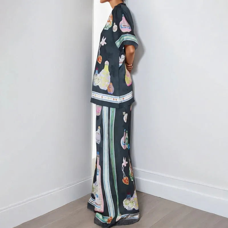Black women's casual set with cartoon print, featuring a cardigan and matching trousers